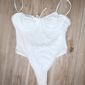 white bow bodysuit/swimsuit
